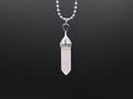 Crystal pendant necklace on a black background
